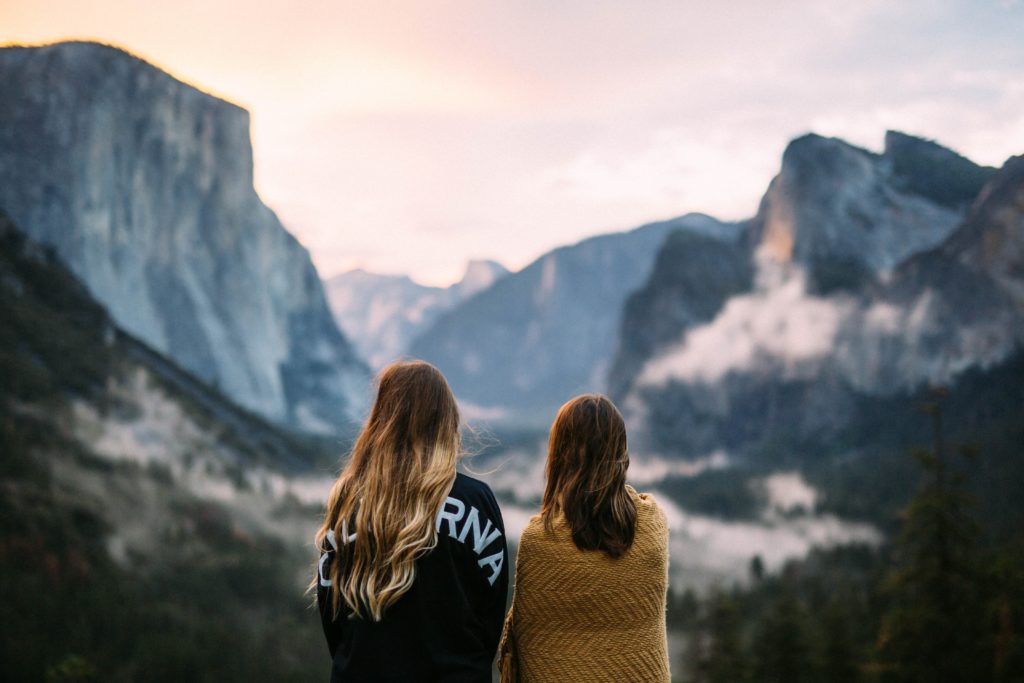 two women look out at nature in yosemite