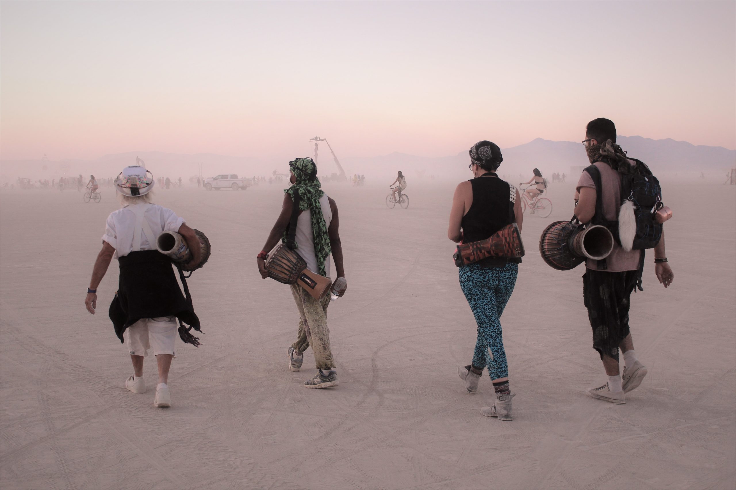 music fans walking in the desert at Burning Man