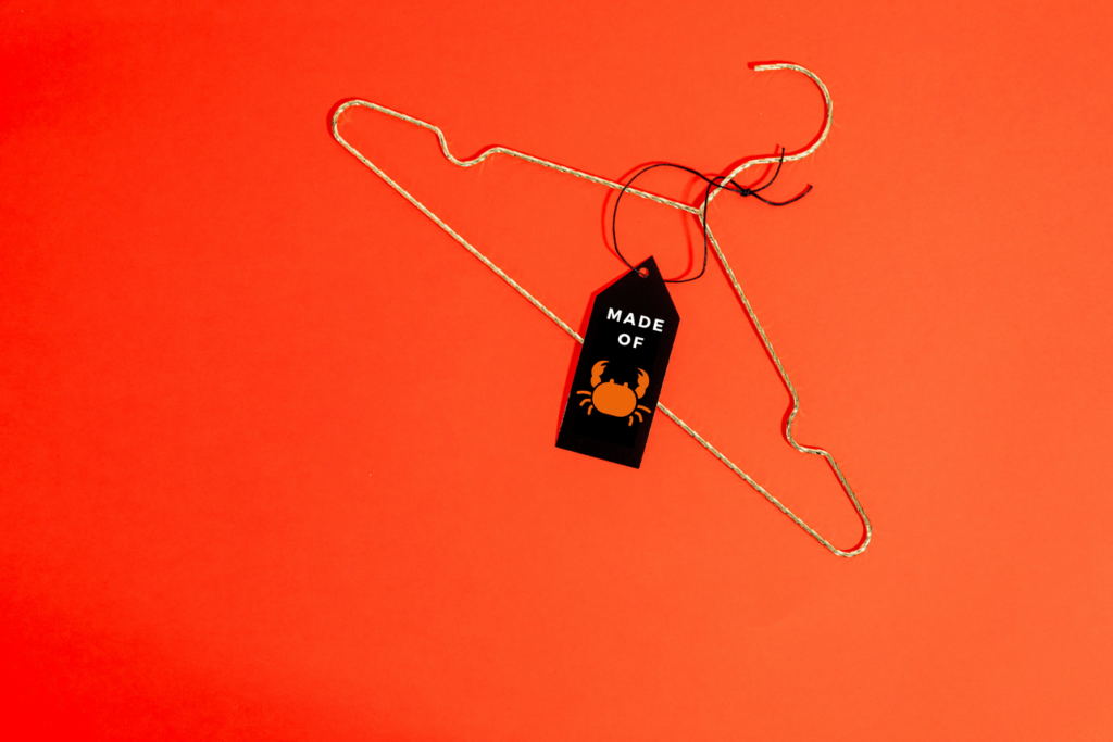 clothes hanger with crab printed tag