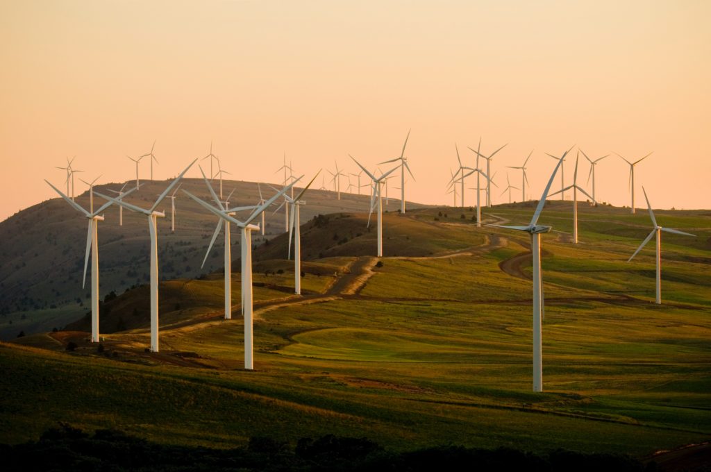 wind turbines hillside at sunset